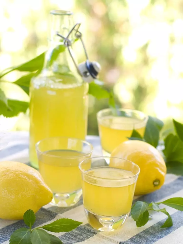 Lemon,Liqour,(limoncello),In,Glass,On,Natural,Background.,Selective,Focus